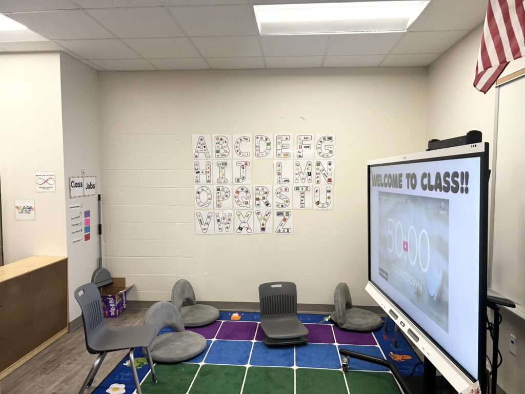 My whole group area, with flexible seating, an alphabet wall, and class jobs
