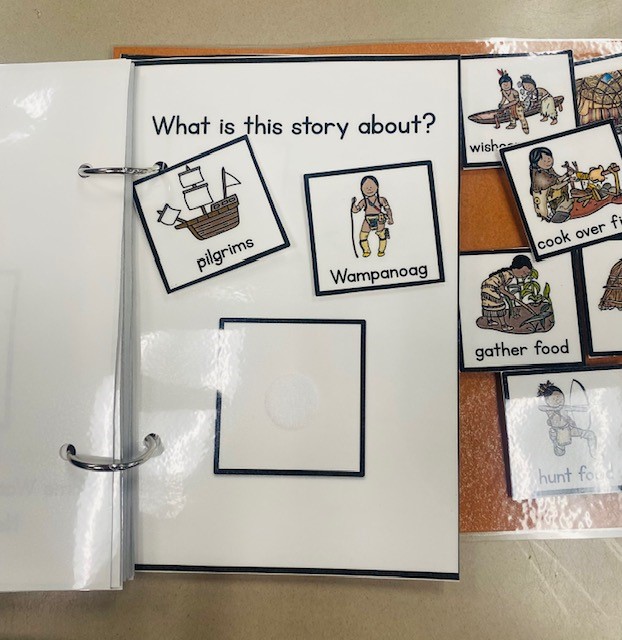 An adapted book page that reads "What is this story about?" Two answer choices are shown: "Pilgrims" and "Wampanoag."