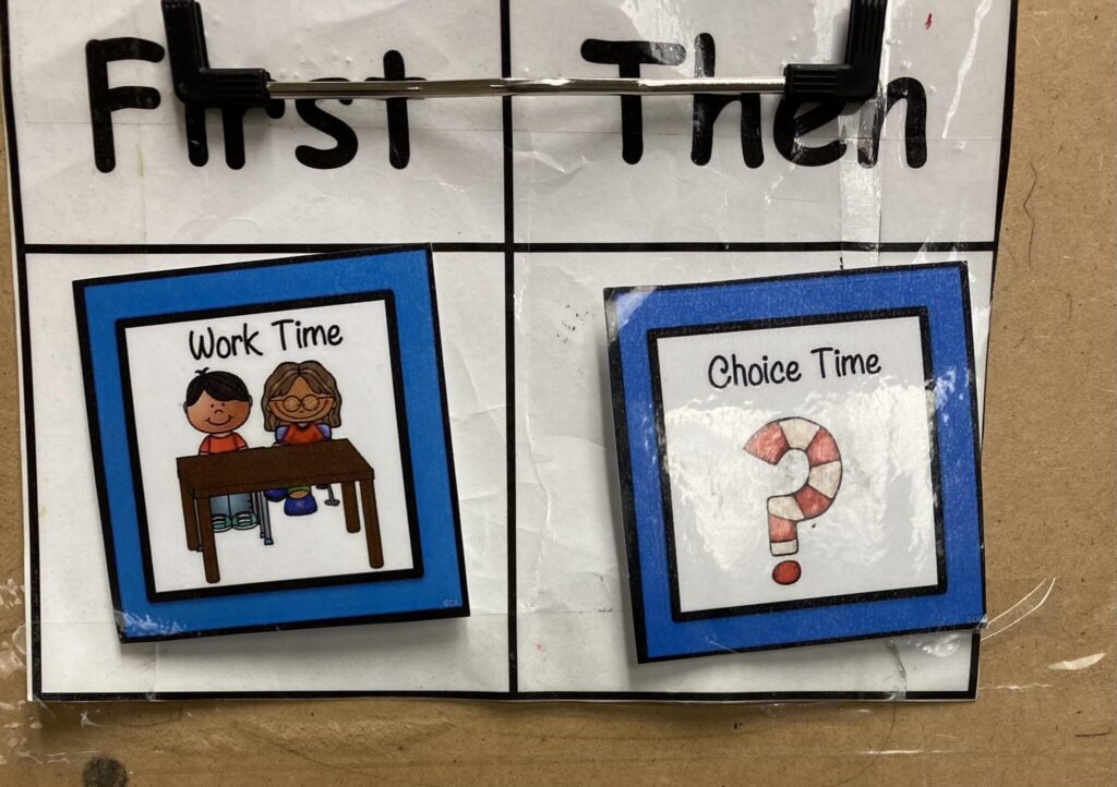 A "first/then" schedule shown on a clipboard 