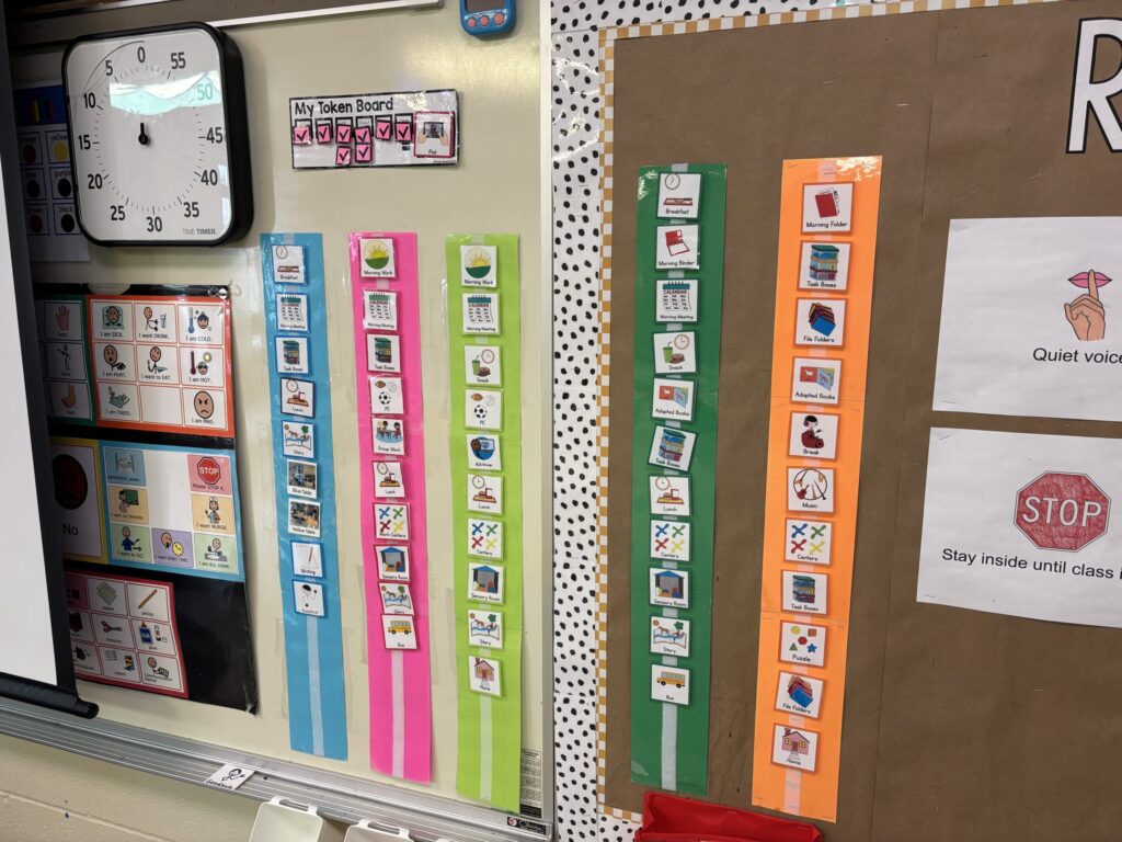 Classroom schedules hang on a wall as part of a routine that must be taught