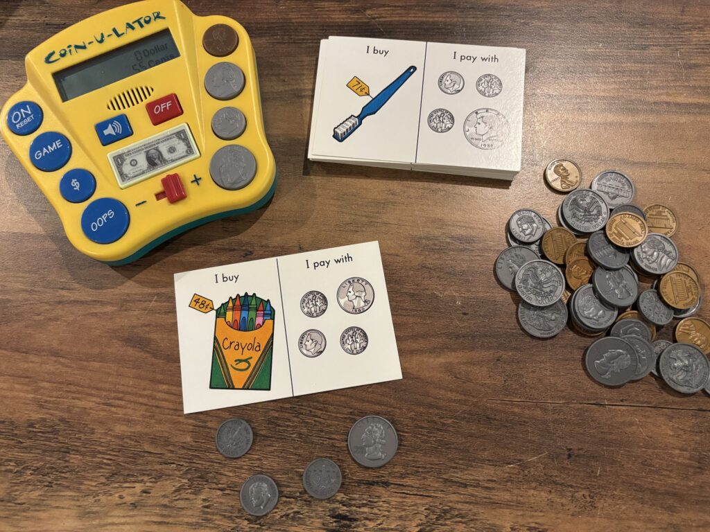 Coins and task cards, as well as a coin-u-lator (visual calculator) 