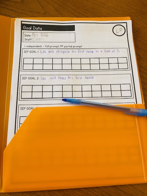 A data sheet in an orange folder