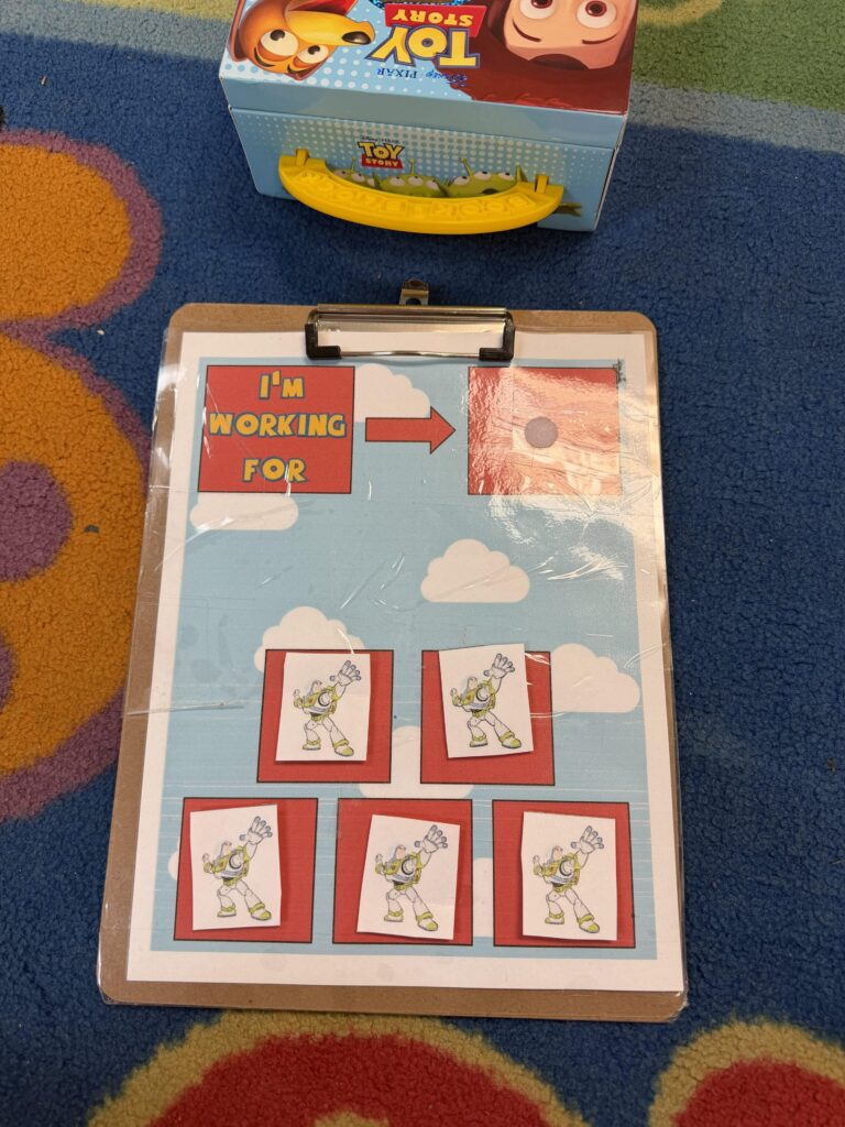 Clipboard with a Buzz Lightyear behavior token chart