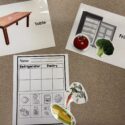 A life skills workbook page in the skill of sorting is shown on a table top with color visuals of food, table, and fridge