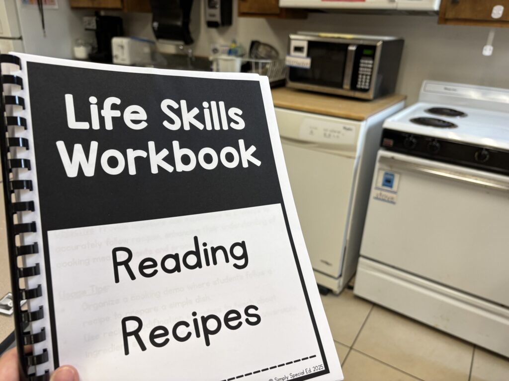 A life skills work ookin the topic of reading recipes is held up in front of a classsroom kitch