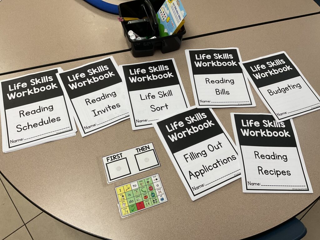 The life skills workbook bundles are laid out on a tabletop