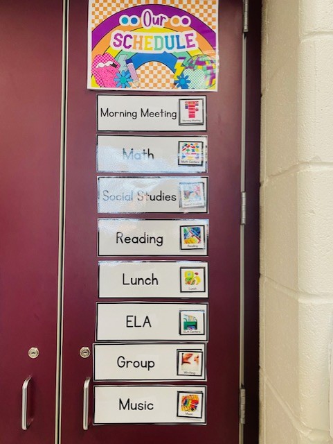 A whole-group visual schedule on a classroom wall