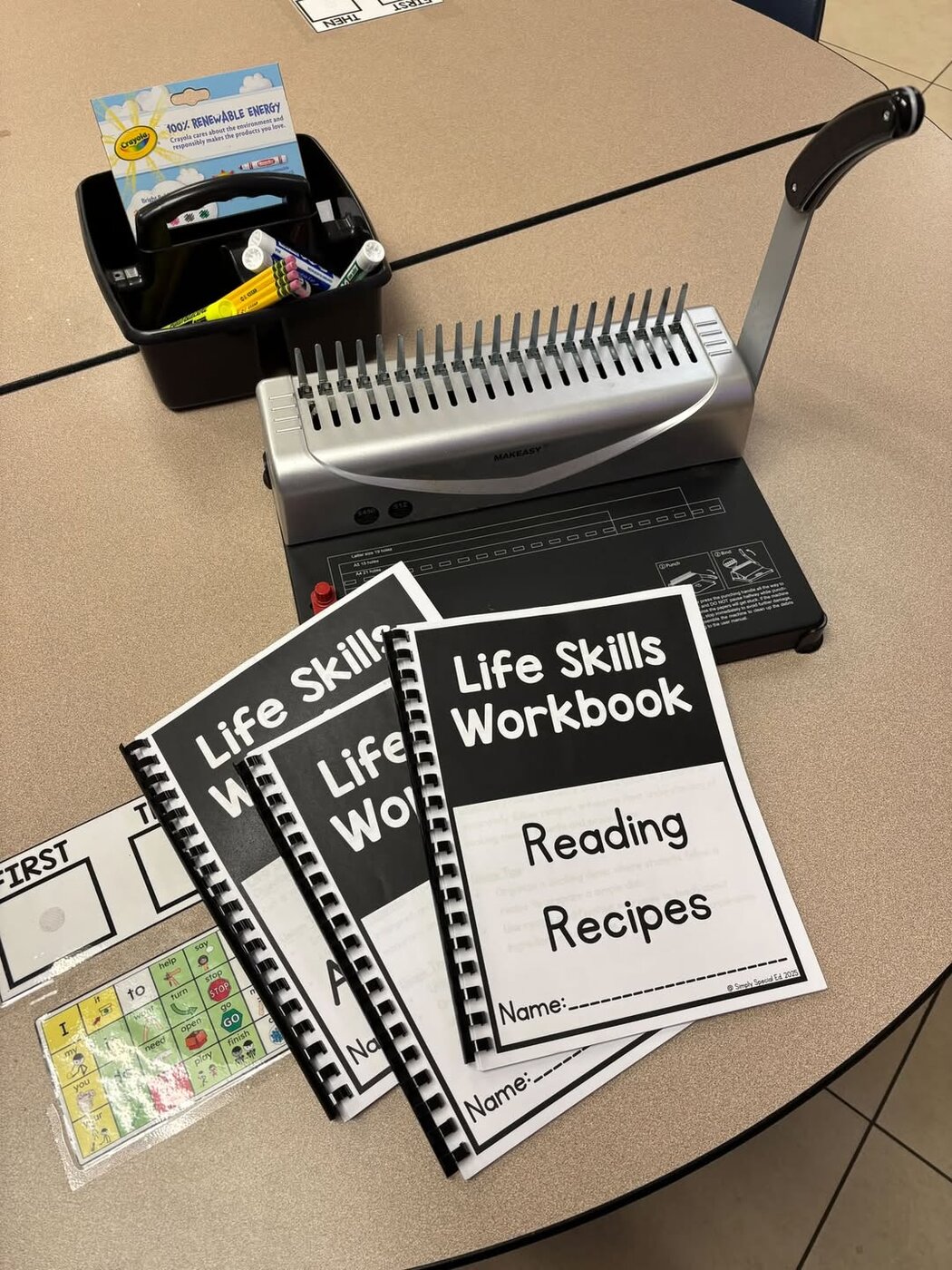 Bound Life Skills Workbooks on a classroom table